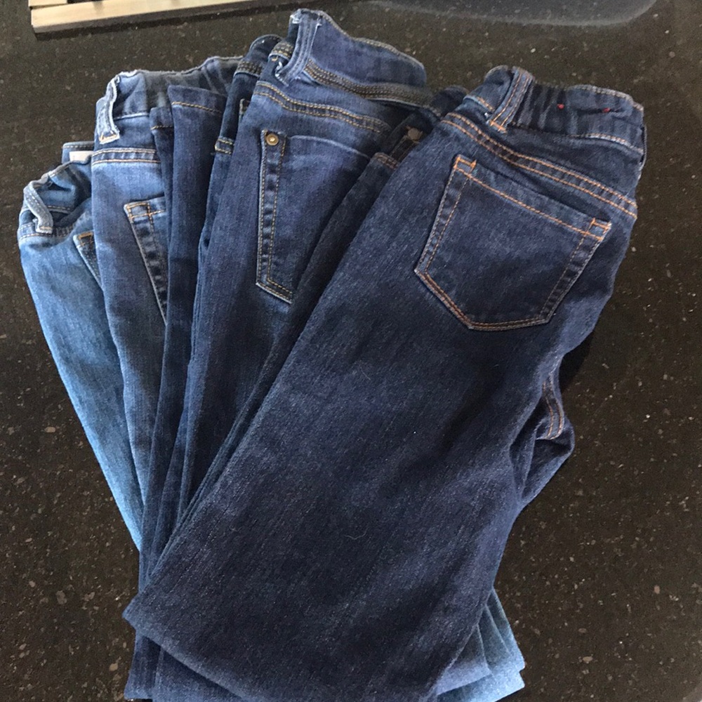 Four pairs of girls jeans.
